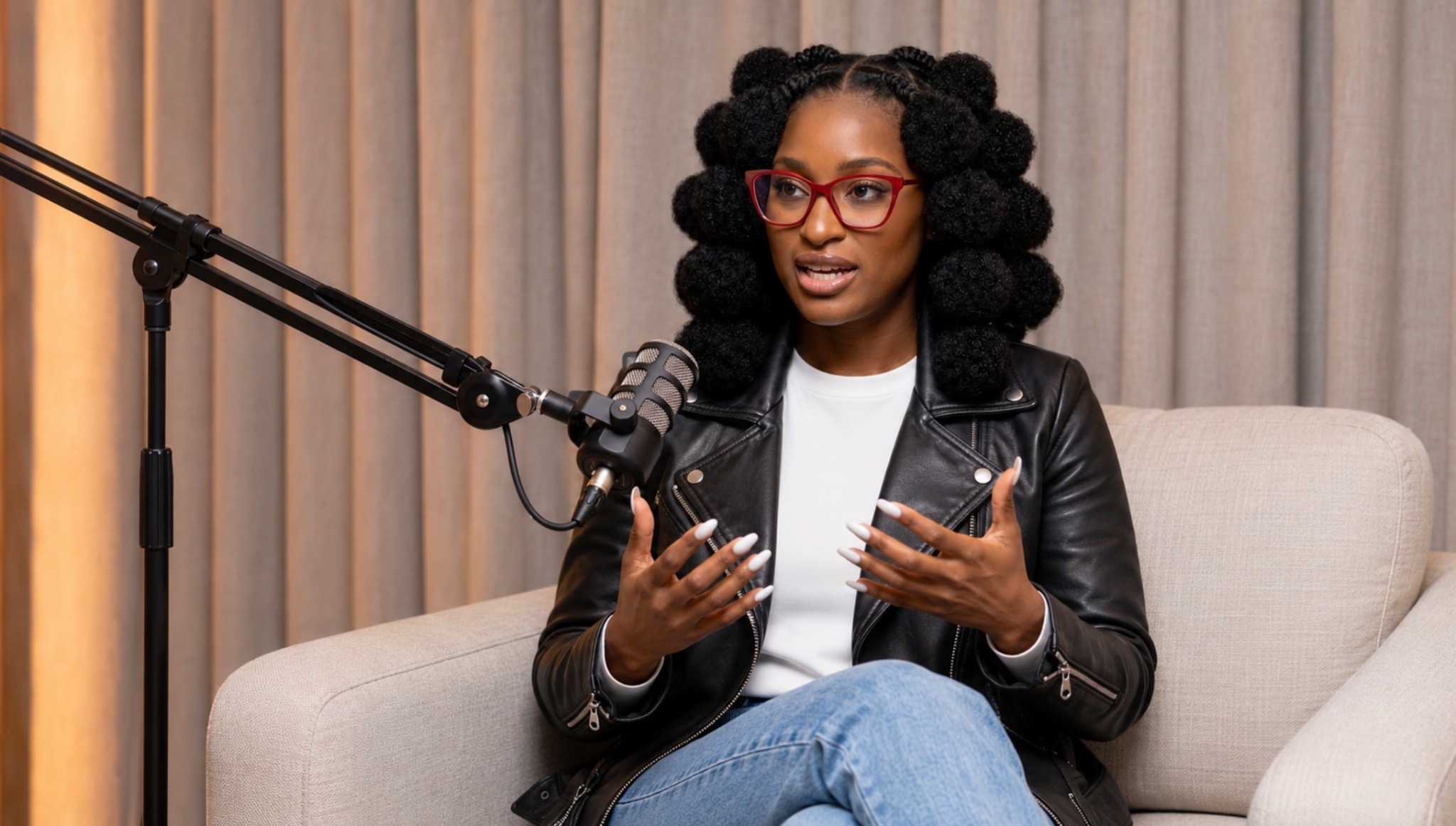 Shiloh seated at a podcast microphone