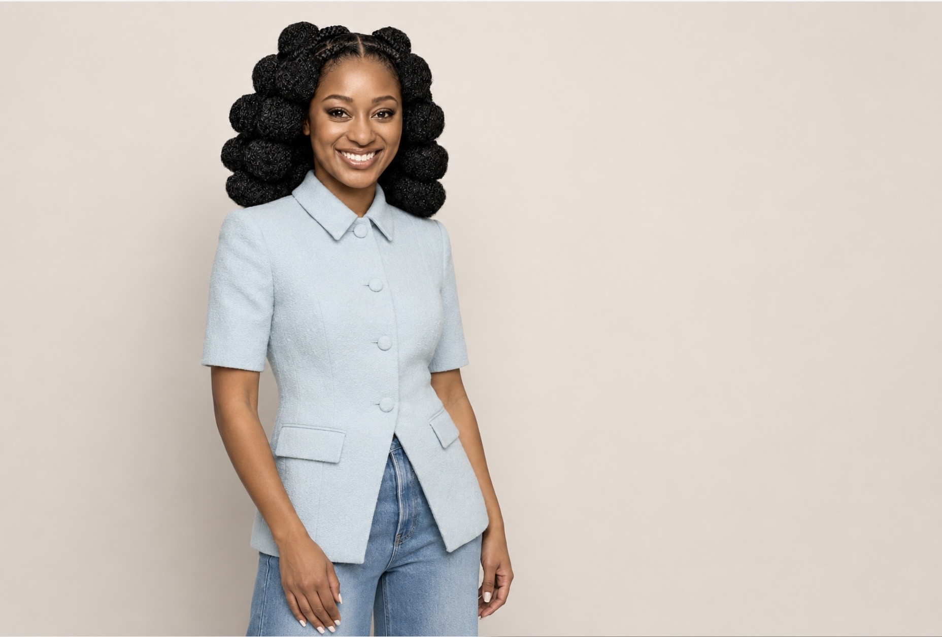 Portrait in a pale blue shirt and jeans